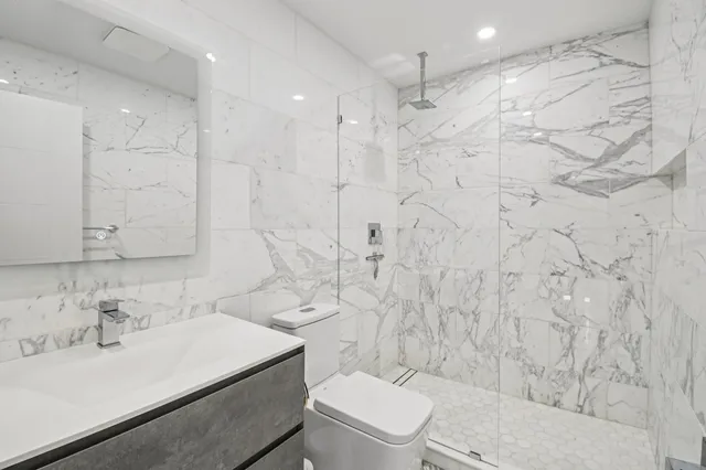 a living room with furniture appliances and wooden floor