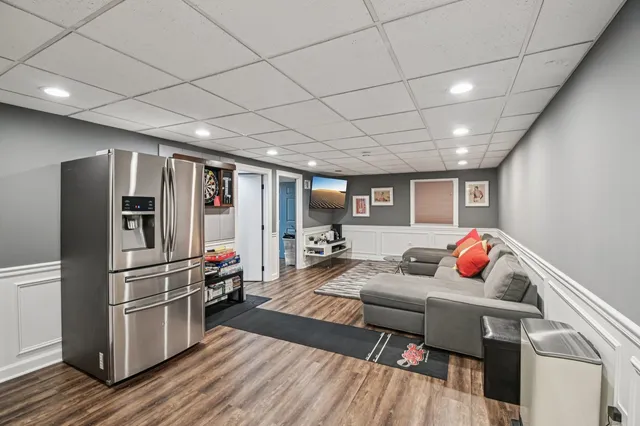 a living room with large lots of books