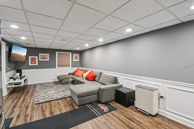 a living room with furniture window and wooden floor