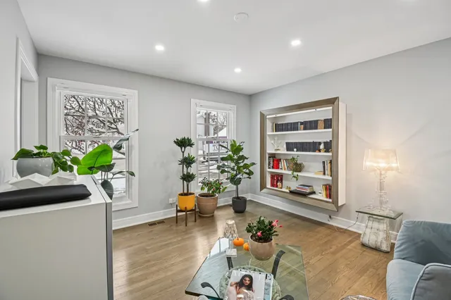 a living room with furniture and a potted plant