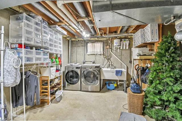 a view of a house with a yard and wooden fence