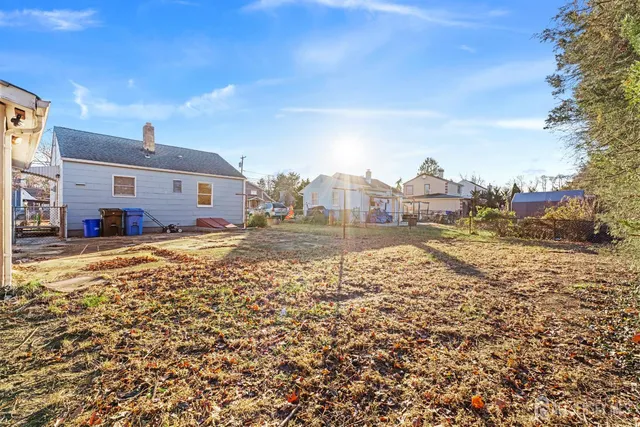 a view of a yard with a tree