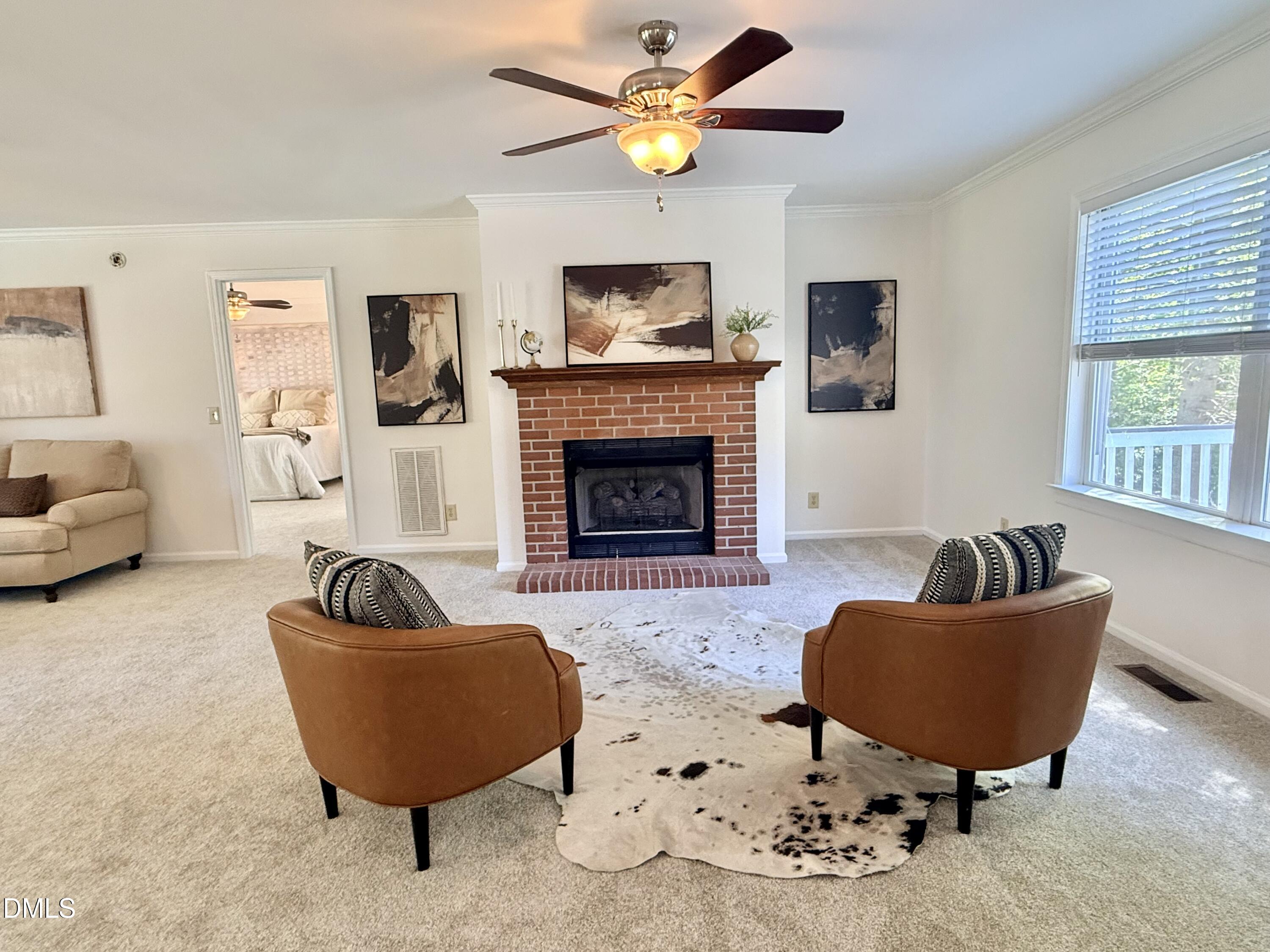 2429 Halifax Road Roxboro, NC 27573 - Photo 3 of 54 a living room with furniture and a fireplace