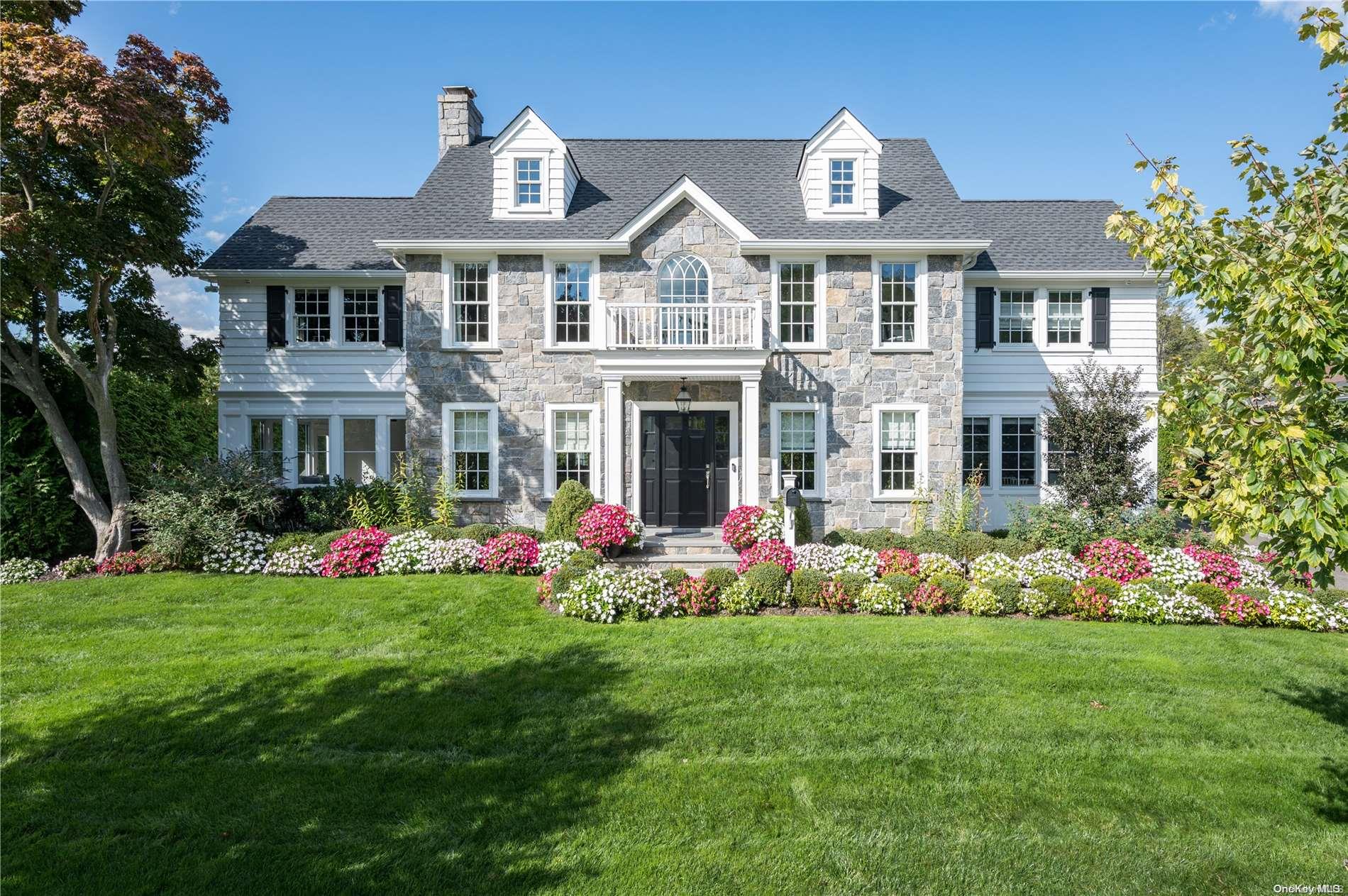 11 Post Avenue Williston Park, NY 11596 - Photo 1 of 1 a front view of a house with garden