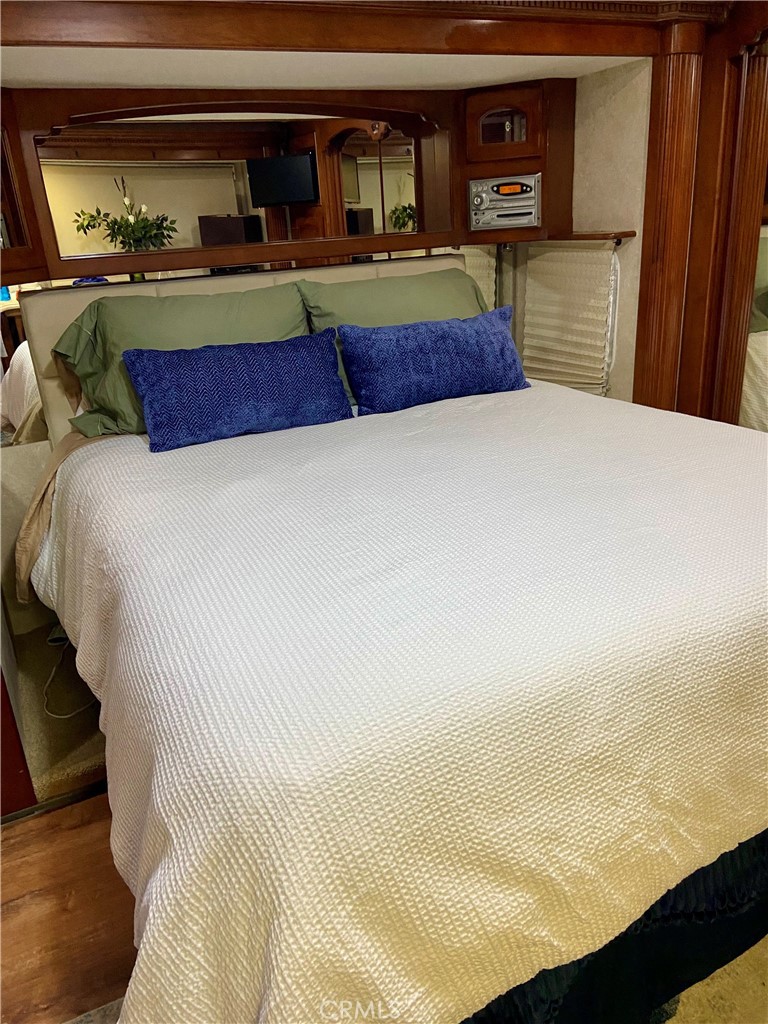 69411 Ramon Road Cathedral City, CA 92234 - Photo 11 of 14 a bedroom with a bed and window