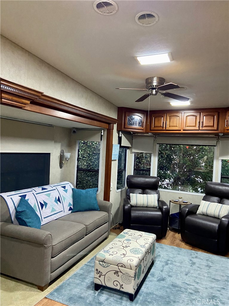 69411 Ramon Road Cathedral City, CA 92234 - Photo 5 of 14 a living room with furniture and a large window
