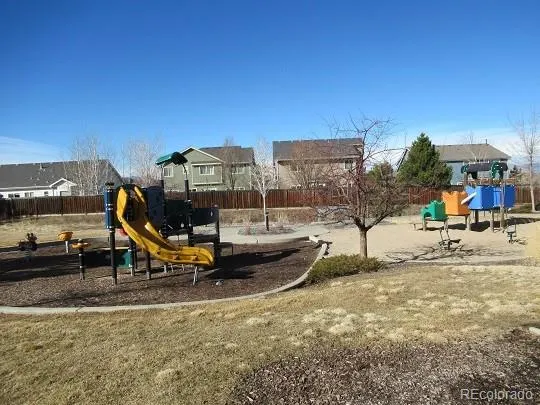 a view of a swimming pool with a lounge chair