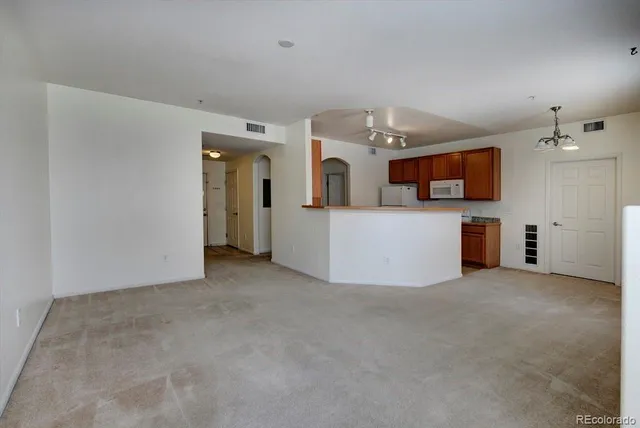 a view of a big room with kitchen view and a window