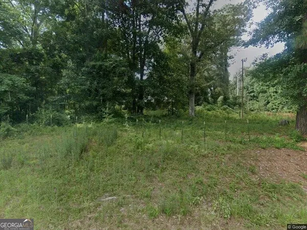 a view of outdoor space and green field