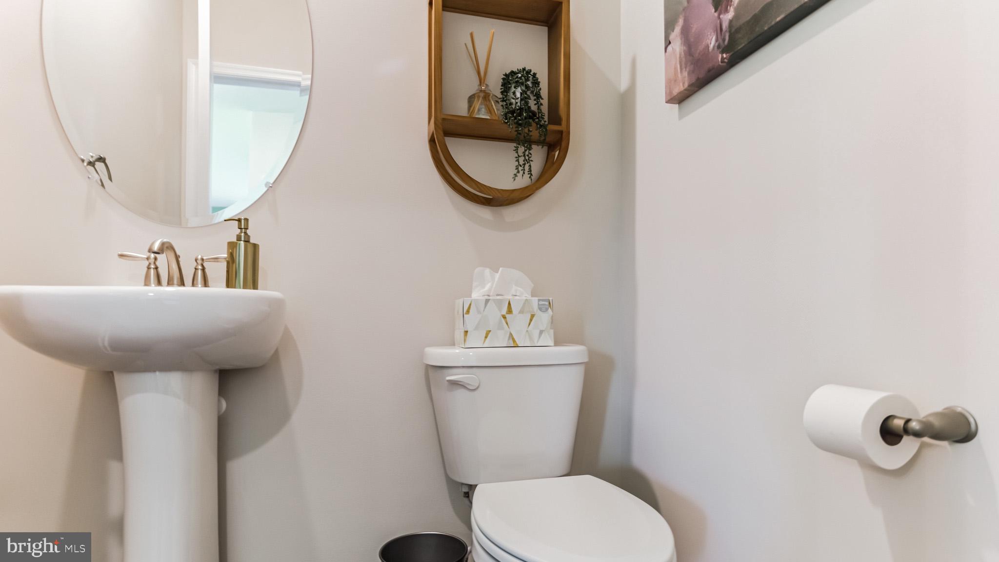 12 Cudesa Court Hanover, PA 17331 - Photo 14 of 25 a bathroom with a toilet a sink and mirror