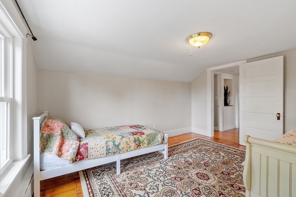 49 Maple Street Oakham, MA 01068 - Photo 29 of 41 a bedroom with a bed and a couch