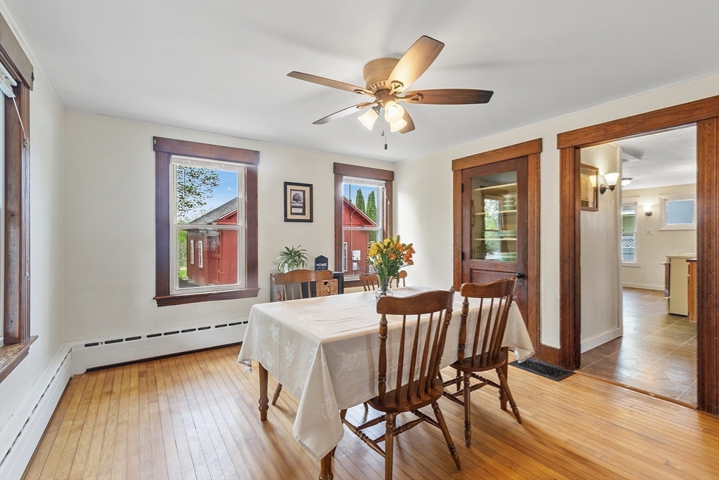 49 Maple Street Oakham, MA 01068 - Photo 8 of 41 a view of a dining room with furniture window and wooden floor