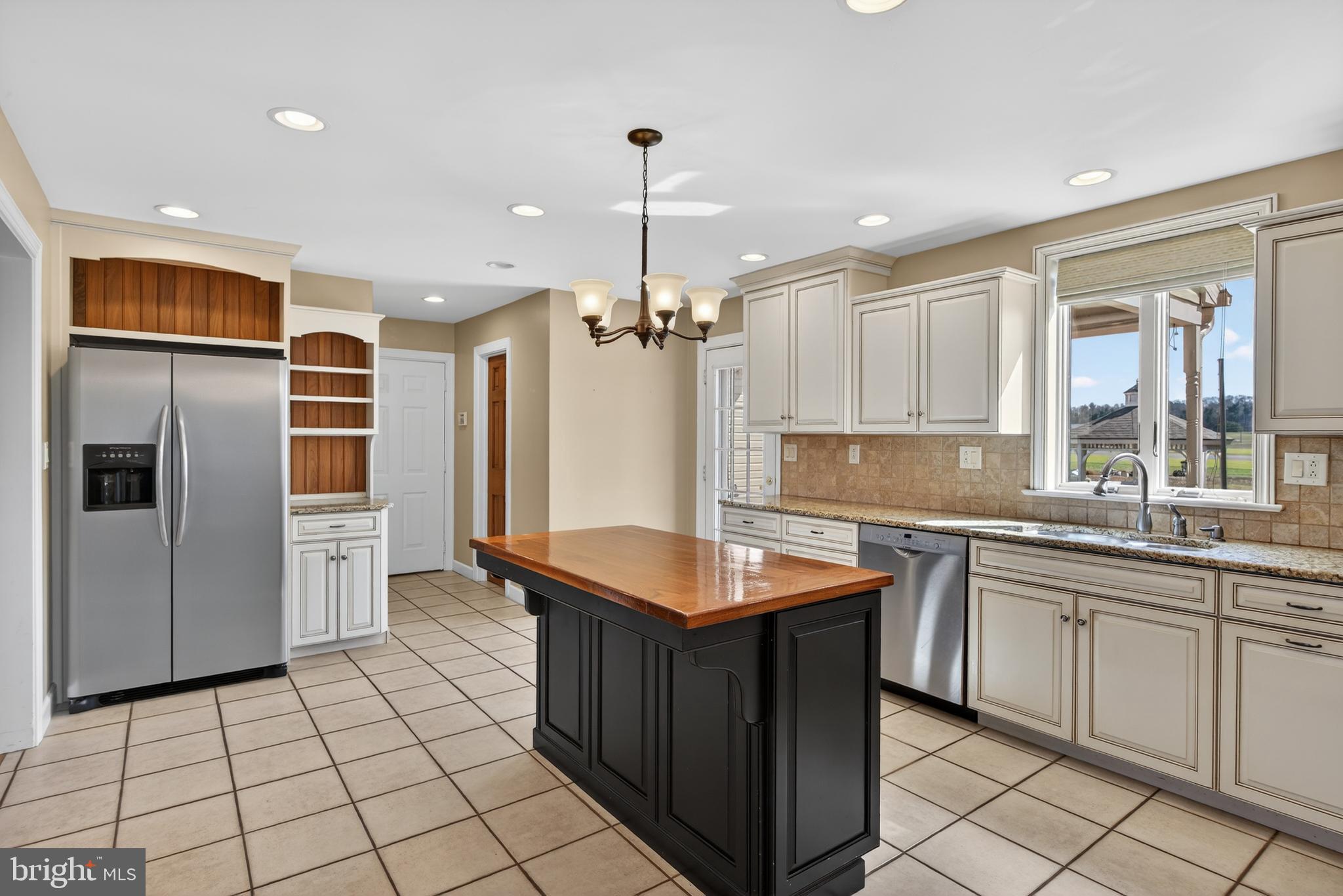 414 Twin Elm Road Strasburg, PA 17579 - Photo 13 of 30 a kitchen with a sink refrigerator and microwave