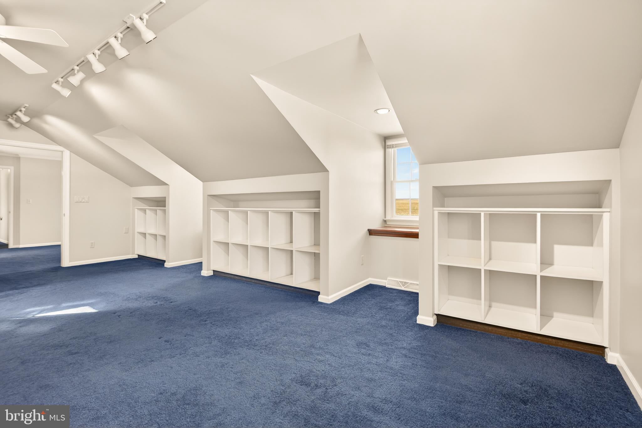 414 Twin Elm Road Strasburg, PA 17579 - Photo 17 of 30 a view of an empty room with a fireplace and a window