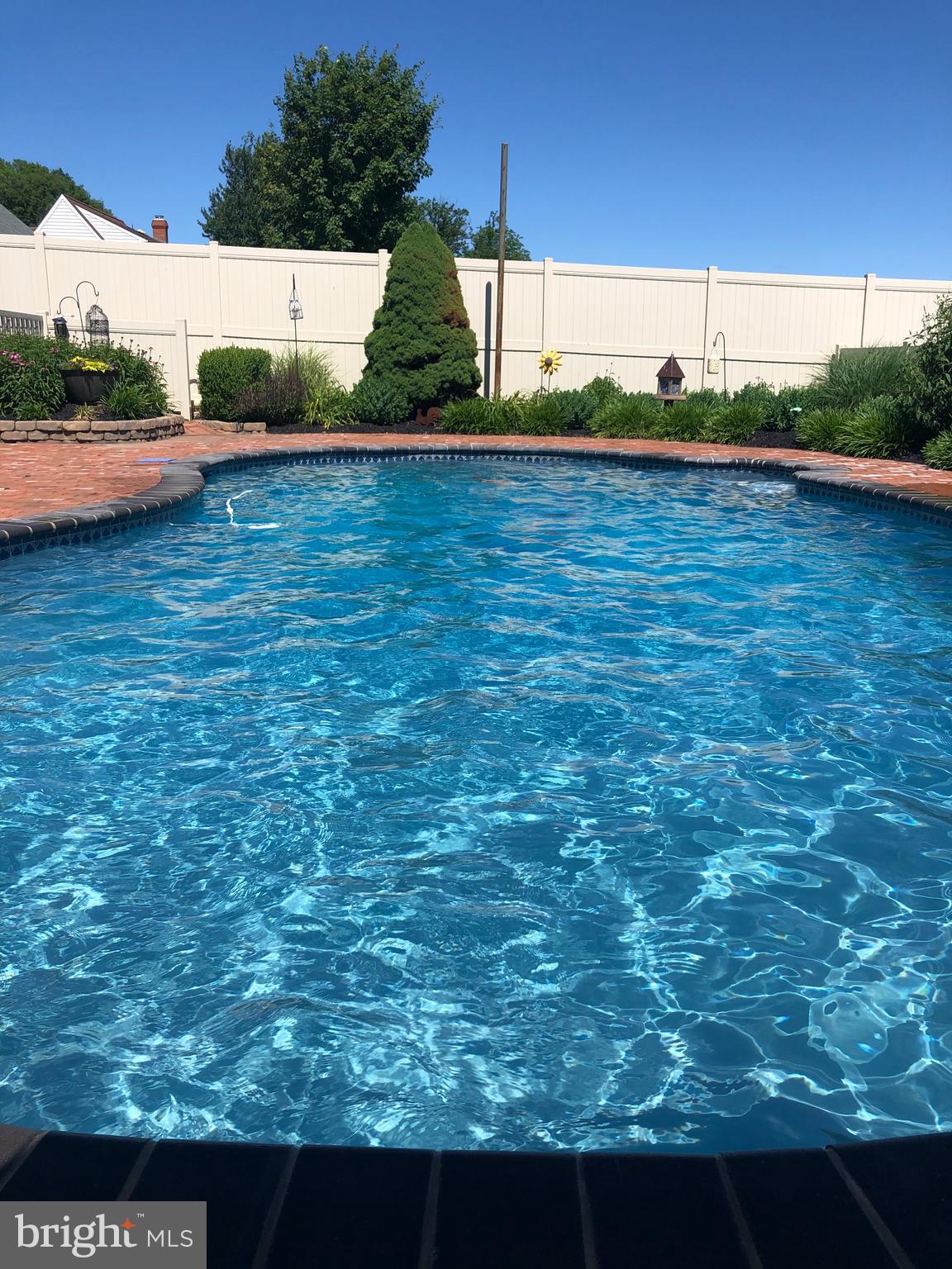 414 Twin Elm Road Strasburg, PA 17579 - Photo 5 of 30 a view of a swimming pool with an outdoor space and seating area
