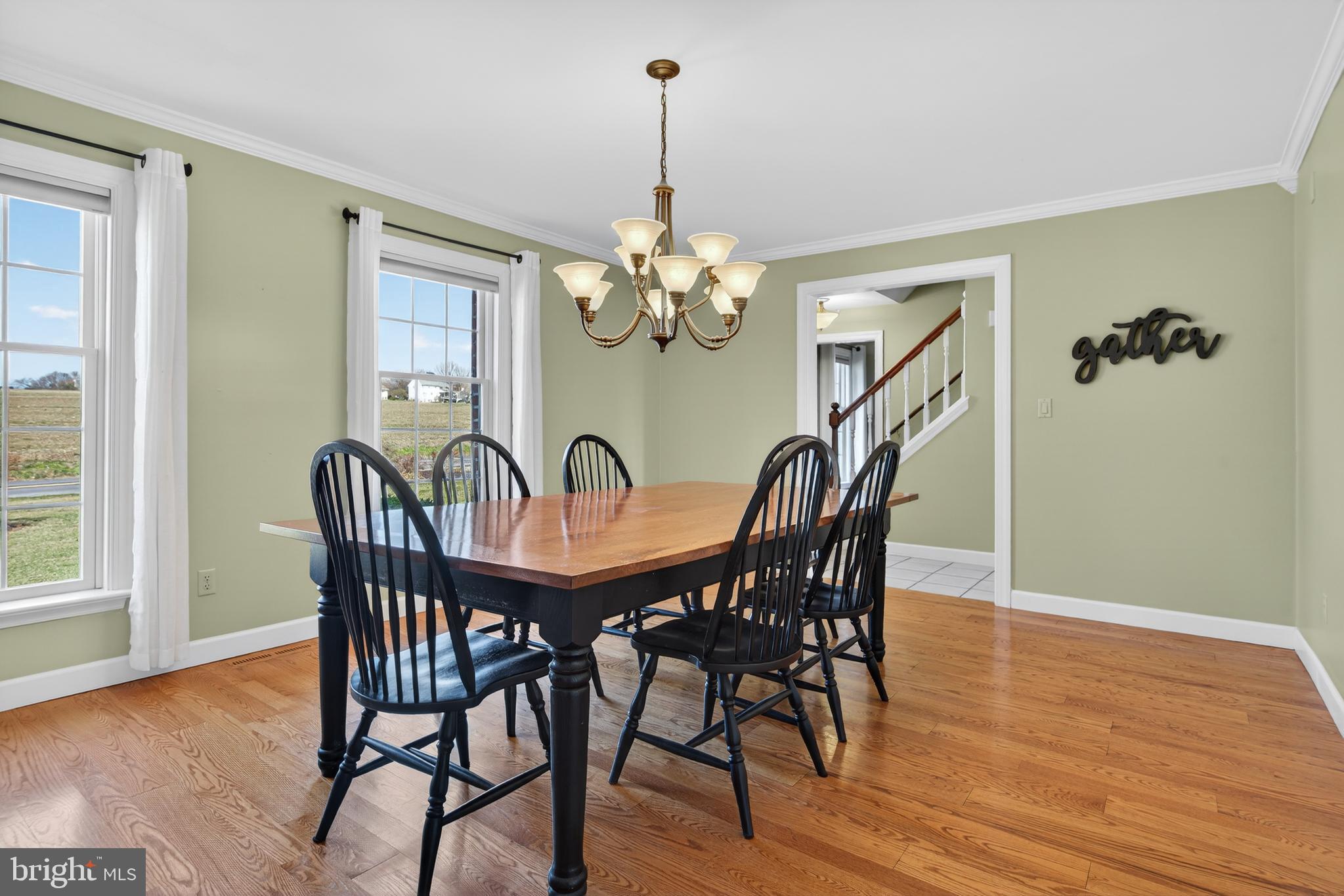 414 Twin Elm Road Strasburg, PA 17579 - Photo 9 of 30 a view of a dining room with furniture wooden floor and chandelier