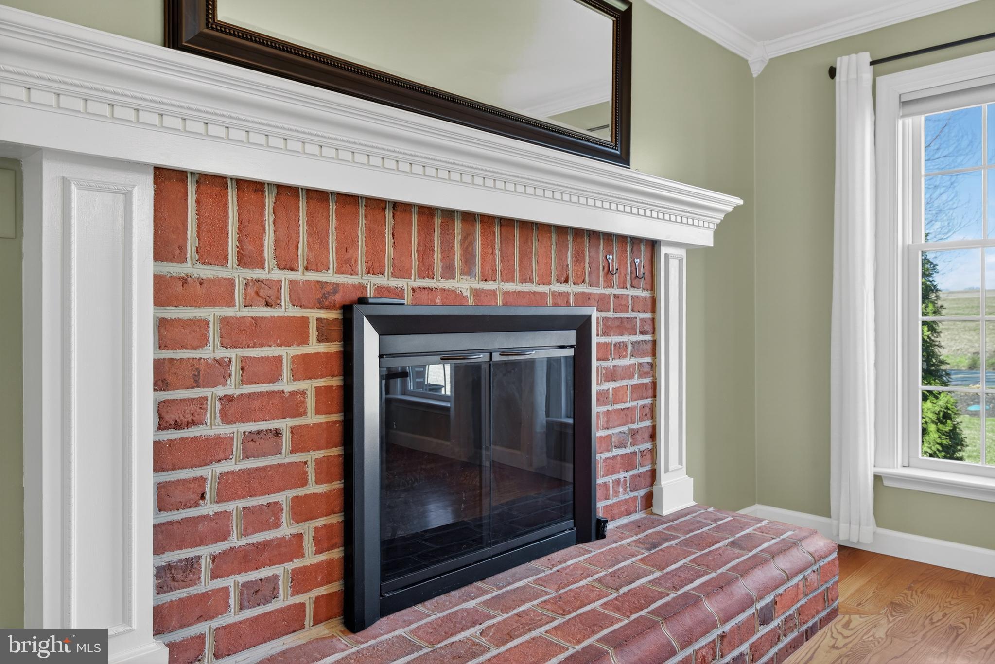 414 Twin Elm Road Strasburg, PA 17579 - Photo 10 of 30 a view of an empty room with a fireplace and a window