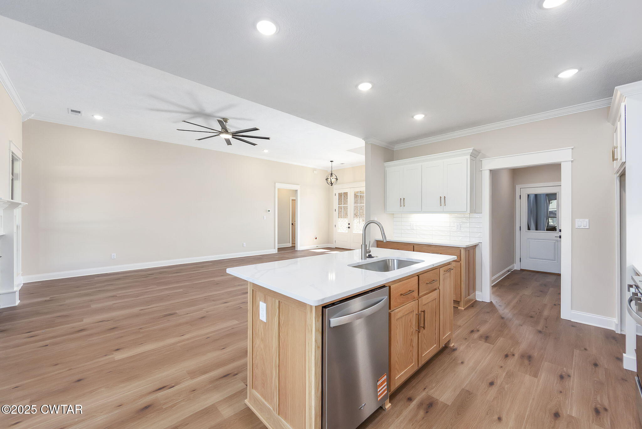24 Enoch Cove Jackson, TN 38305 - Photo 11 of 30 a kitchen with a sink stove and wooden floor