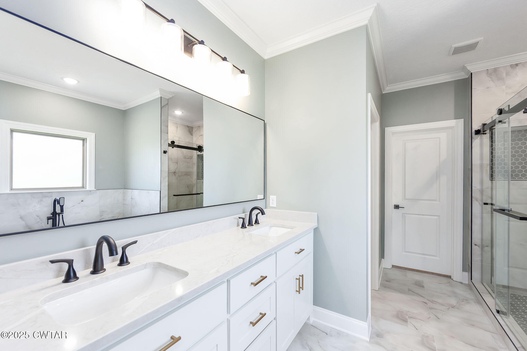 24 Enoch Cove Jackson, TN 38305 - Photo 16 of 30 a bathroom with double vanity sink and a mirror