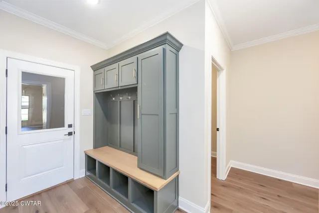 a view of a kitchen with wooden floor