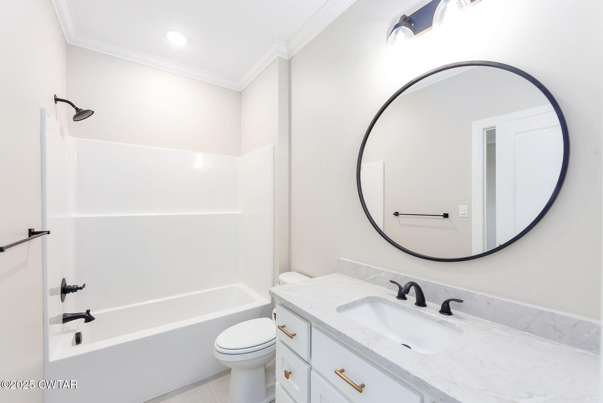 24 Enoch Cove Jackson, TN 38305 - Photo 25 of 30 a bathroom with a sink a toilet and a mirror