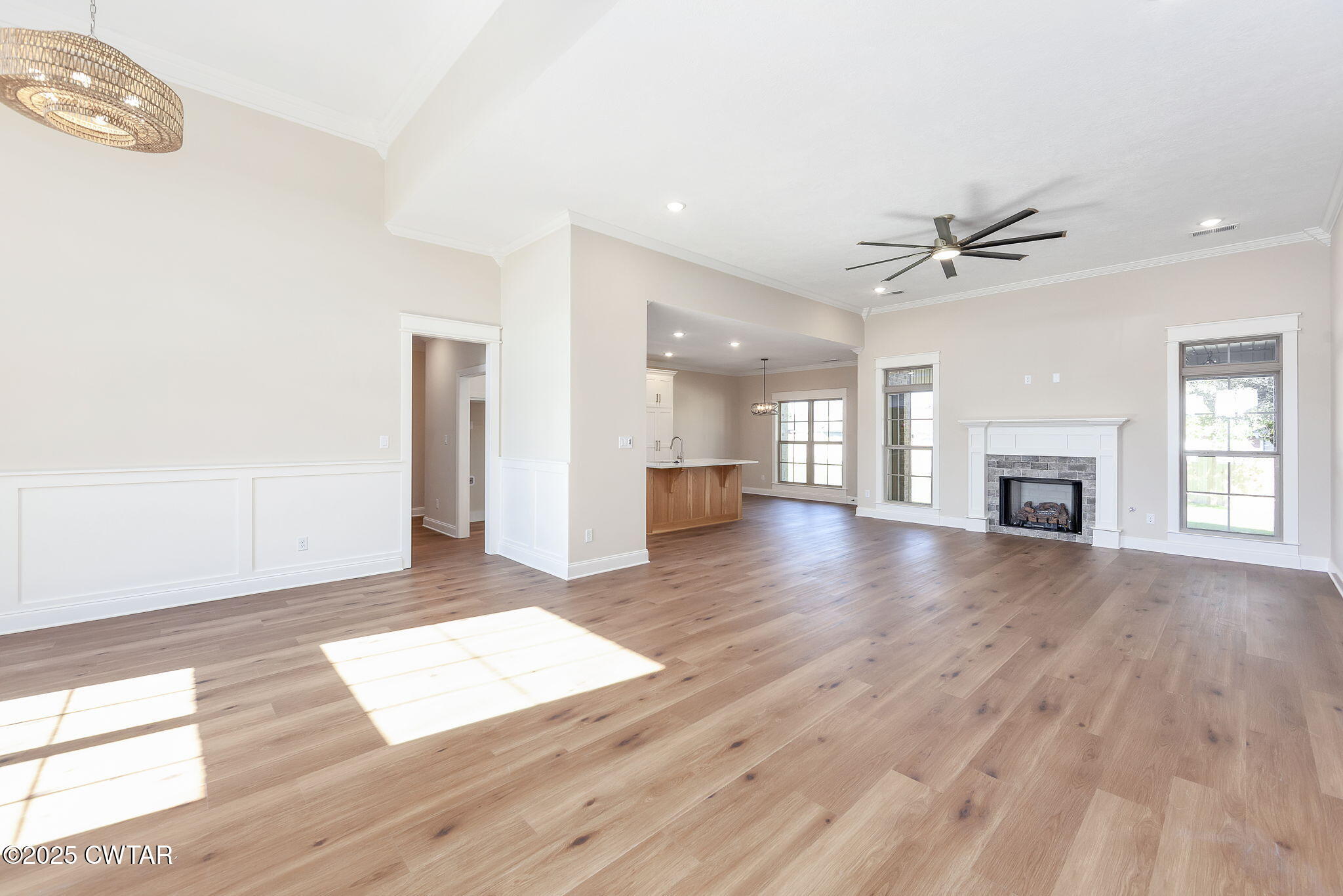 24 Enoch Cove Jackson, TN 38305 - Photo 4 of 30 a view of an empty room with wooden floor and a window