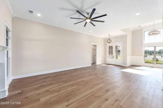 a view of a kitchen with a sink and a living room
