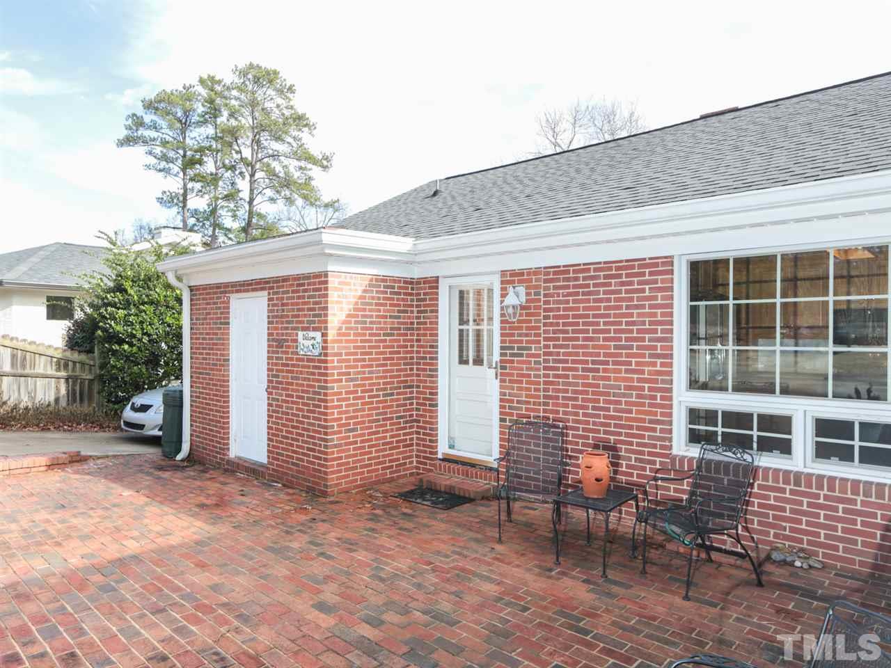 2113 Coley Forest Place Raleigh, NC 27607 - Photo 4 of 25 a backyard of a house with seating space