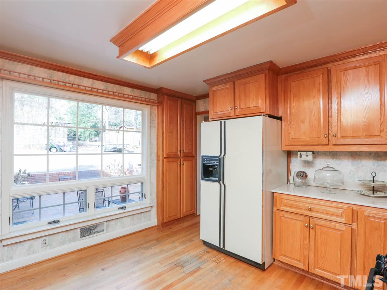 2113 Coley Forest Place Raleigh, NC 27607 - Photo 5 of 25 a kitchen with stainless steel appliances a refrigerator and a stove