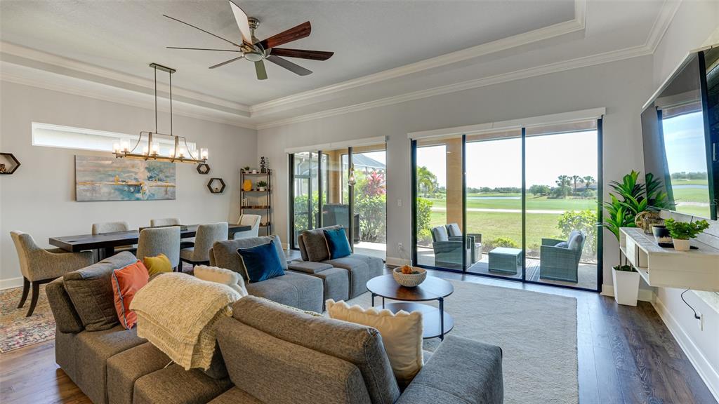 4511 Terrazza Court Lakewood Ranch, FL 34211 - Photo 6 of 65 a living room with furniture large window and wooden floor