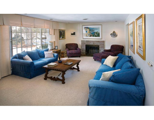 63 Lovett Road Newton, MA 02459 - Photo 2 of 5 a living room with furniture a large window and a fireplace