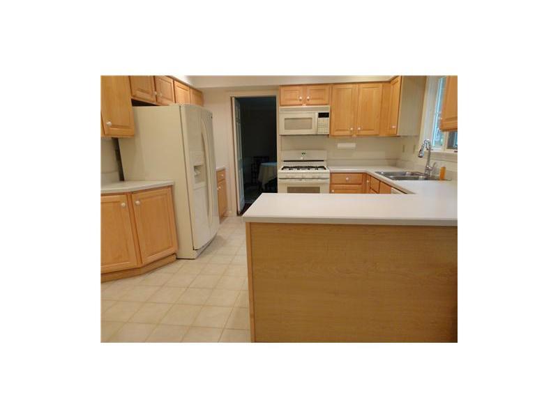 209 Highland Road Fox Chapel, PA 15238 - Photo 6 of 18 Kitchen. Updated kitchen features clean white appliances that complement sizable wooden cabinetry.
