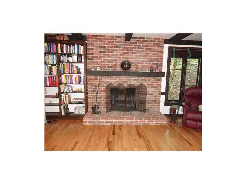 209 Highland Road Fox Chapel, PA 15238 - Photo 8 of 18 Family Room. Cozy brick fireplace creates a homey, comfprtable atmosphere.