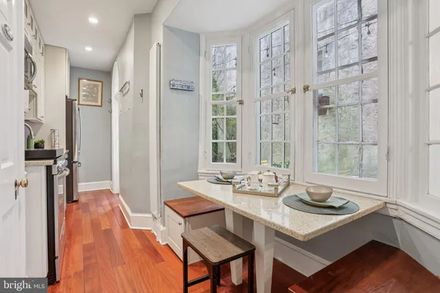 a view of a dining room with furniture window and outside view