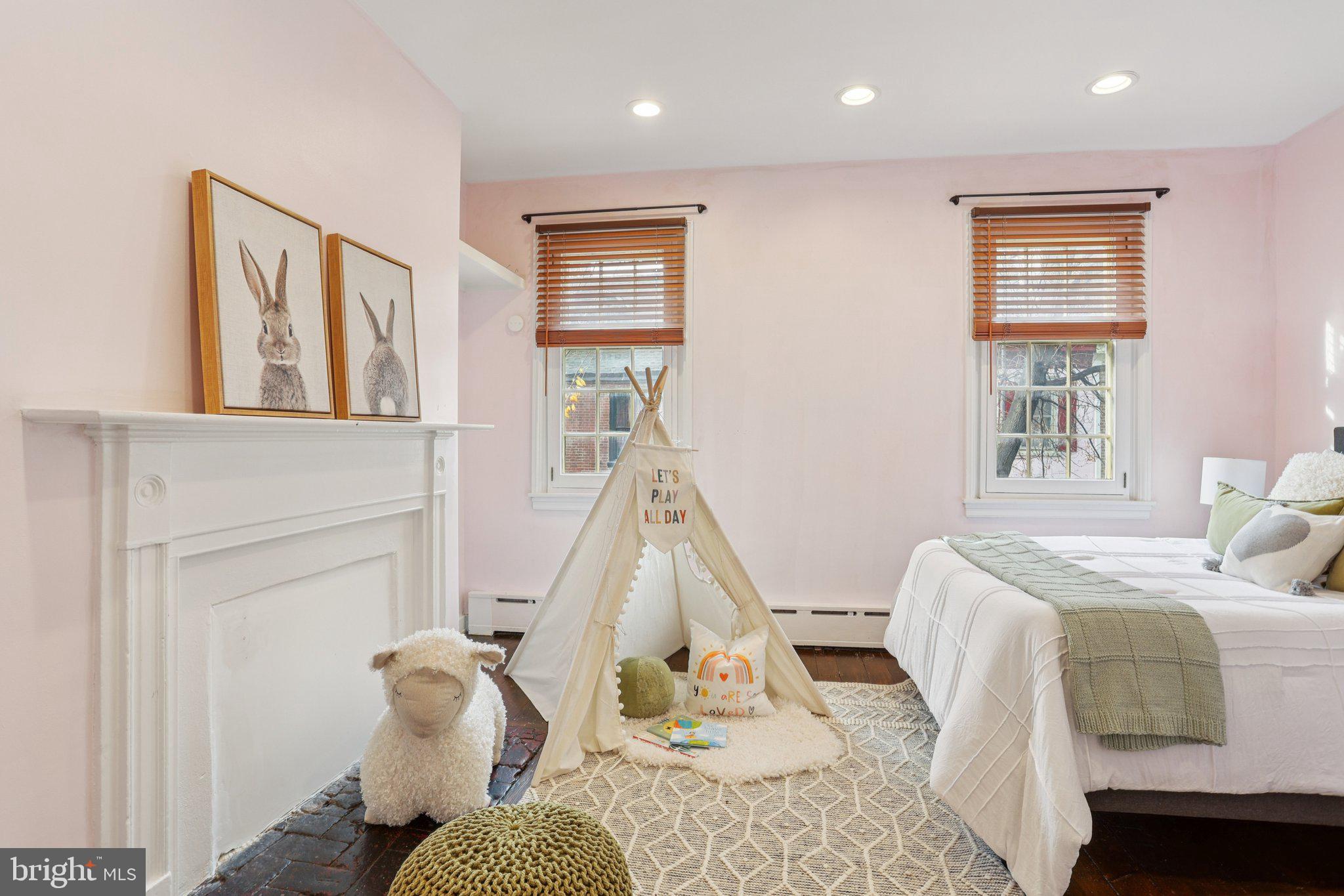 323 South Camac Street Philadelphia, PA 19107 - Photo 17 of 37 a bedroom with a bed and wooden floor