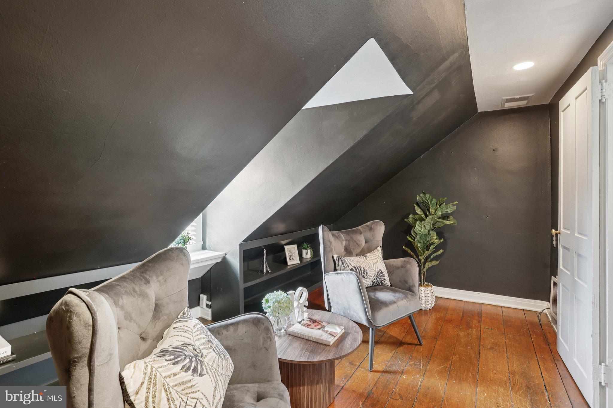323 South Camac Street Philadelphia, PA 19107 - Photo 26 of 37 a living room with furniture and flowers