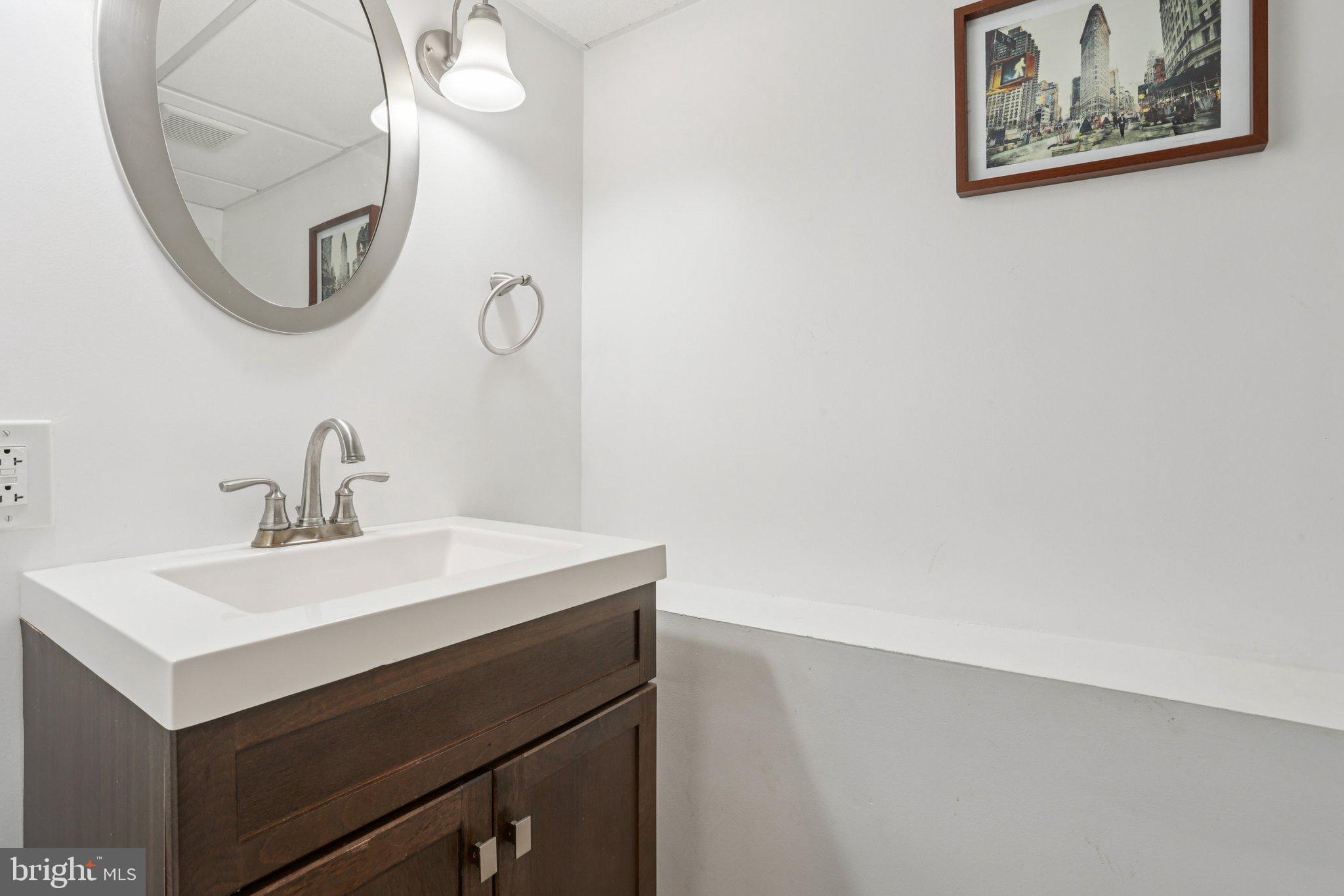 323 South Camac Street Philadelphia, PA 19107 - Photo 33 of 37 a bathroom with a sink and a mirror
