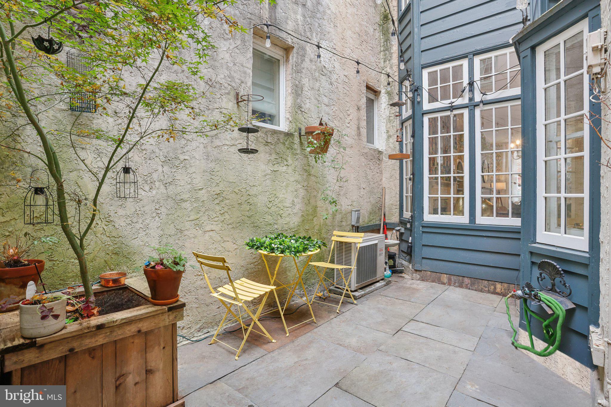 323 South Camac Street Philadelphia, PA 19107 - Photo 37 of 37 a backyard of a house with outdoor seating
