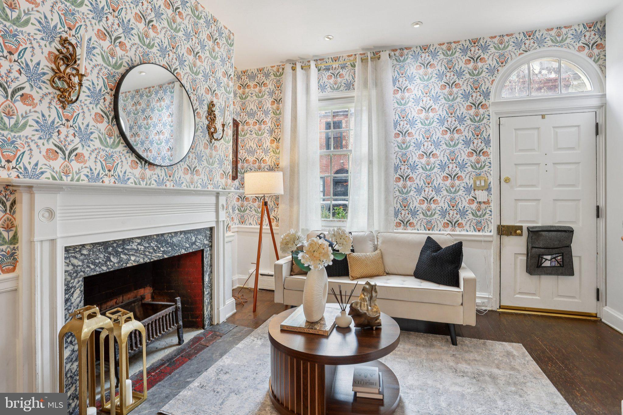 323 South Camac Street Philadelphia, PA 19107 - Photo 4 of 37 a living room with furniture a fireplace and a table