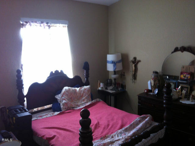 3182 Laurel Ridge Circle Riviera Beach, FL 33404 - Photo 11 of 23 a bed room with a bed and a window