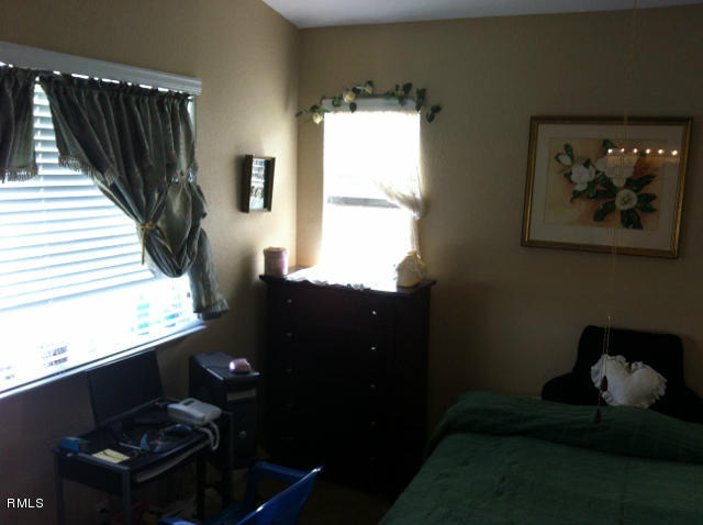 3182 Laurel Ridge Circle Riviera Beach, FL 33404 - Photo 13 of 23 a living room with furniture and a window