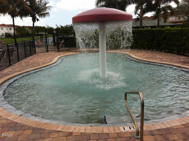 3182 Laurel Ridge Circle Riviera Beach, FL 33404 - Photo 19 of 23 a outdoor view with a sitting space