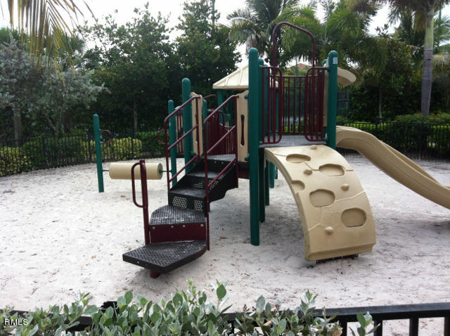 3182 Laurel Ridge Circle Riviera Beach, FL 33404 - Photo 20 of 23 a view of a bench in the backyard