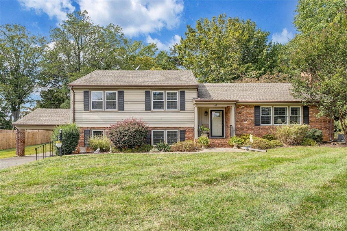 1441 Trents Ferry Road Lynchburg, VA 24503 - Photo 11 of 67 a front view of a house with a yard and trees
