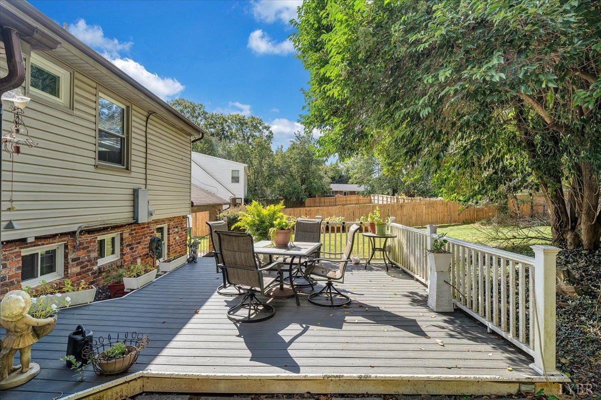 1441 Trents Ferry Road Lynchburg, VA 24503 - Photo 3 of 67 a view of a patio with table and chairs and wooden floor