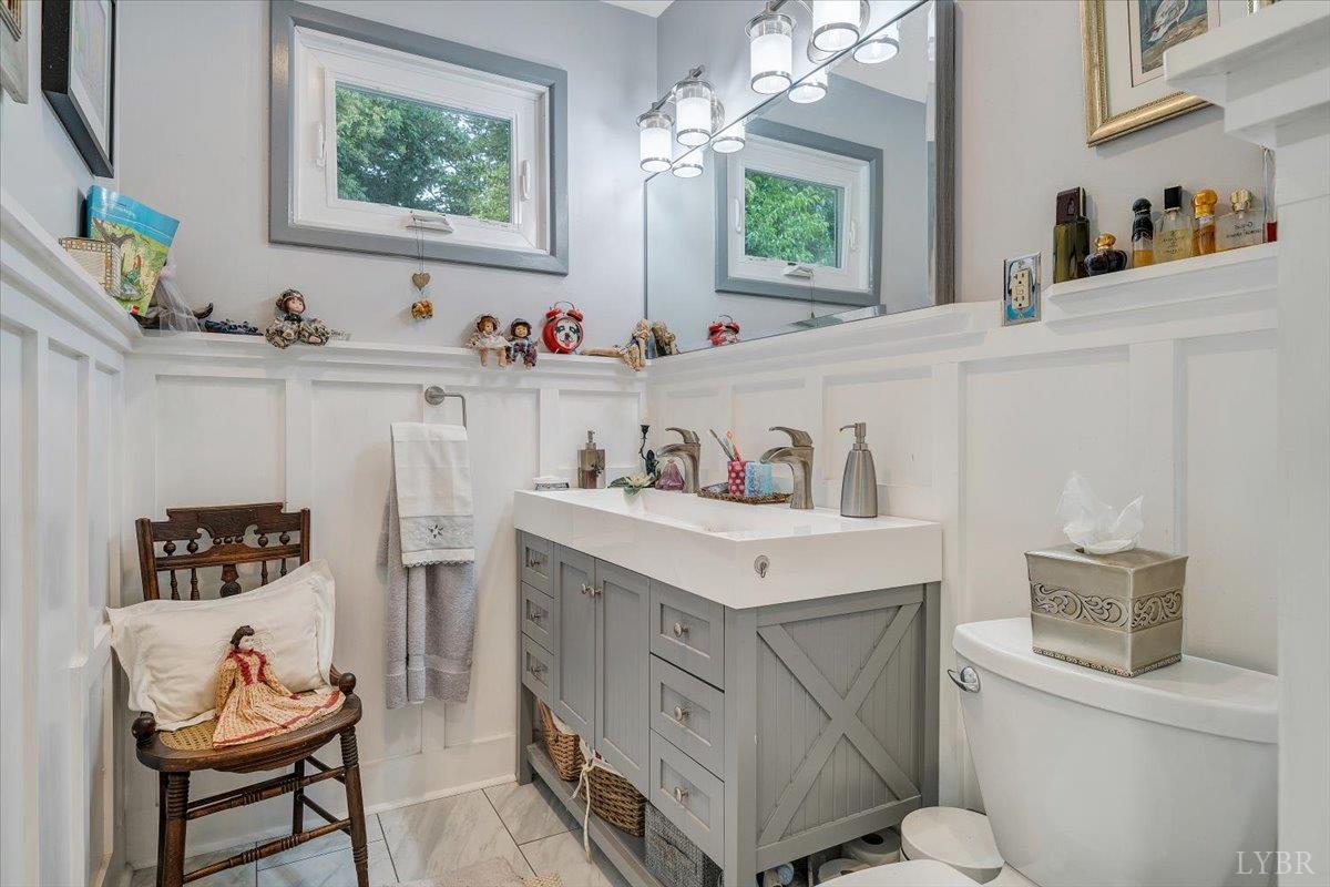 1441 Trents Ferry Road Lynchburg, VA 24503 - Photo 61 of 67 a bathroom with a sink toilet and a mirror