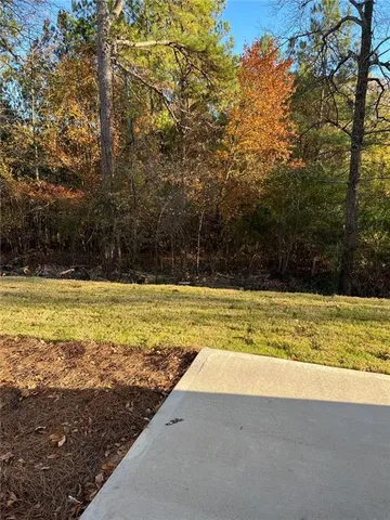 a view of a backyard of the house