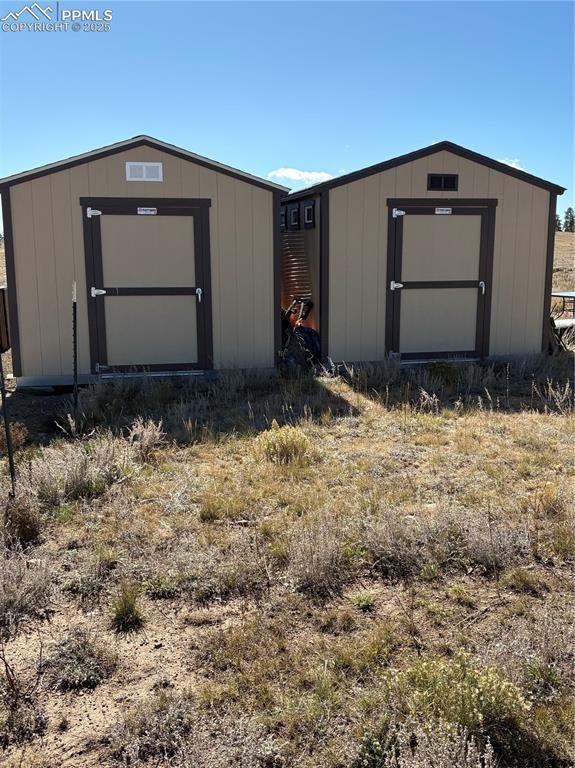 1925 Doe Valley Road Guffey, CO 80820 - Photo 24 of 31 a front view of a house with a yard
