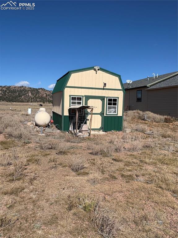 1925 Doe Valley Road Guffey, CO 80820 - Photo 25 of 31 a view of a house with a yard