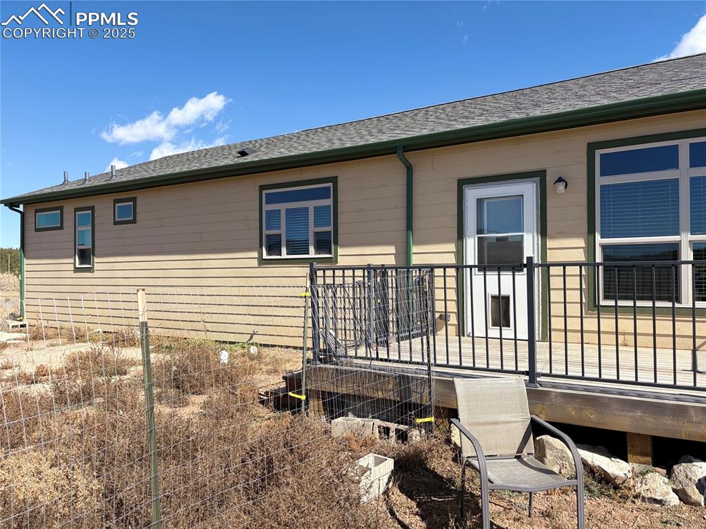 1925 Doe Valley Road Guffey, CO 80820 - Photo 5 of 31 a front view of a house with a balcony
